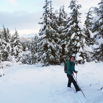 Emily Mosites hikes through snow in Alaska.