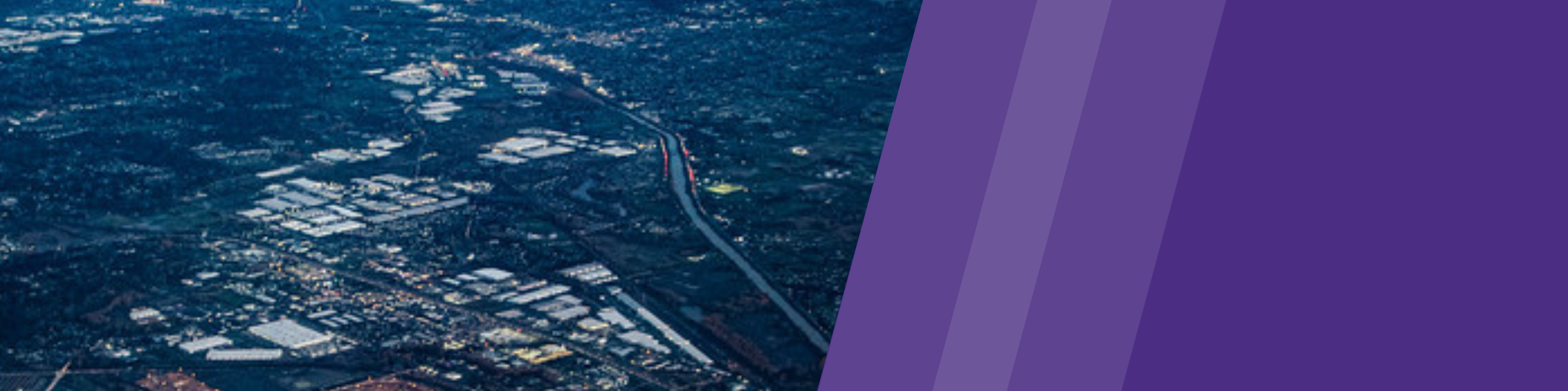 Aerial photo of South Seattle and Duamish River with purple UW brand banner